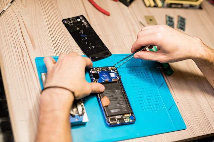 Phone Repair technician working on a smartphone during professional mobile phone servicing.