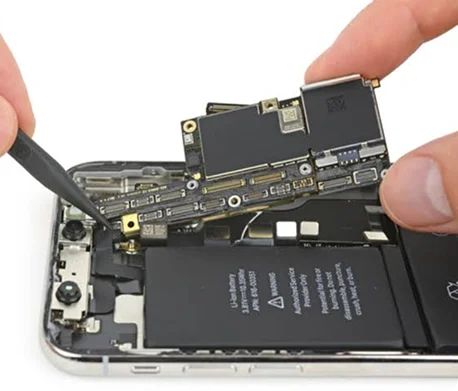 Disassembled smartphone showing internal components during professional phone repair.