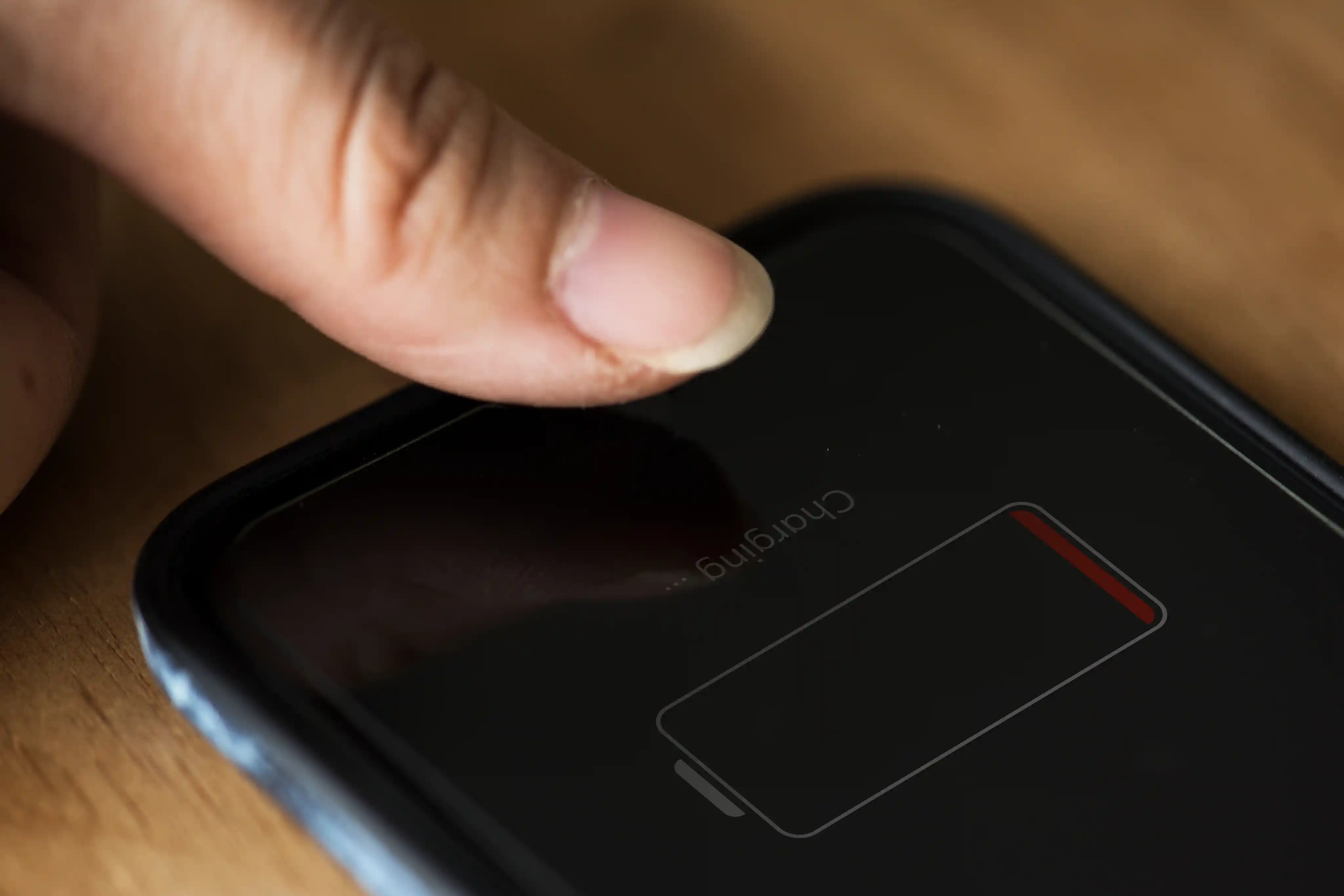 Smartphone showing a critically low battery level before battery replacement